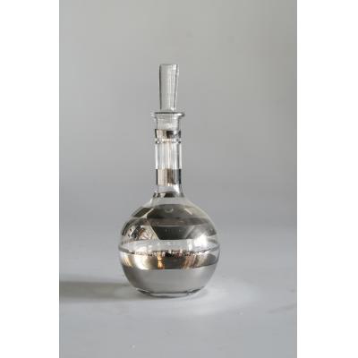 Glass decanter with silver decanter